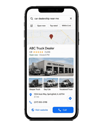 A mobile Google Maps search for "car dealership near me" showing a truck dealer's local listing with photos, rating, and call button